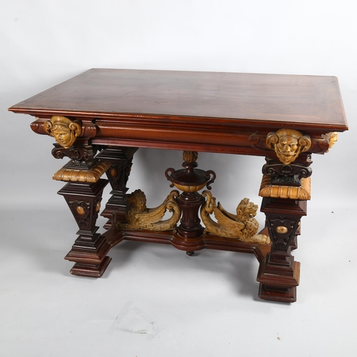 306 - An early 20th Century walnut centre table, with carved surround and carved winged Lion stretcher, 12... 