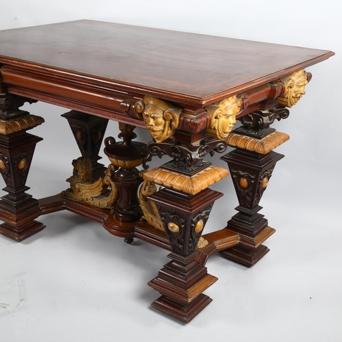 306 - An early 20th Century walnut centre table, with carved surround and carved winged Lion stretcher, 12... 