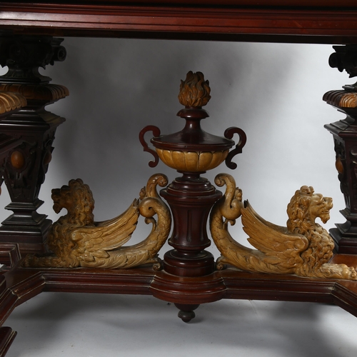 306 - An early 20th Century walnut centre table, with carved surround and carved winged Lion stretcher, 12... 