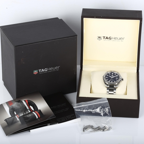 1003 - TAG HEUER - a stainless steel Aquaracer automatic bracelet watch, ref. WAY2110, black dial with lumi... 