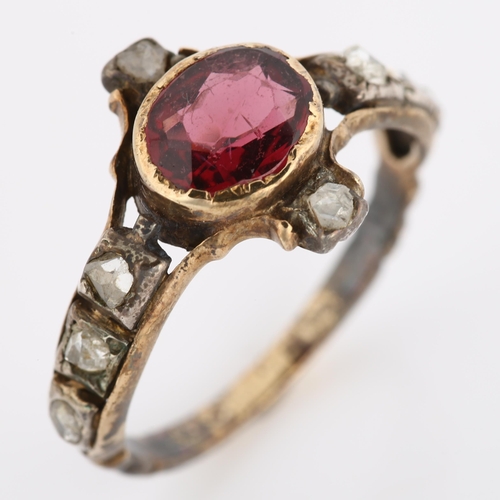 1054 - A Georgian garnet and diamond ring, unmarked gold settings with oval mixed-cut garnet and rose-cut d... 