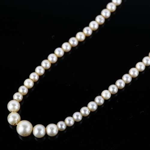 1061 - A single-strand graduated imitation seed pearl necklace, with 9ct rose gold barrel clasp, pearls mea... 