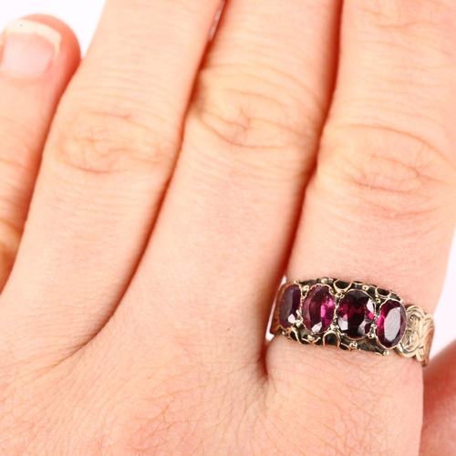 1068 - A Victorian 18ct gold four stone garnet half hoop ring, closed-back settings with floral engraved sh... 