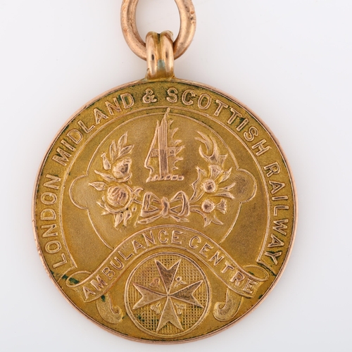 1070 - An Art Deco 9ct gold London Midland & Scottish Railway Ambulance Centre Long Service Medal, inscribe... 