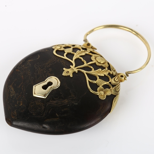 1074 - A 17th century gold-mounted tortoiseshell heart padlock charm, openwork floral design, overall heigh... 