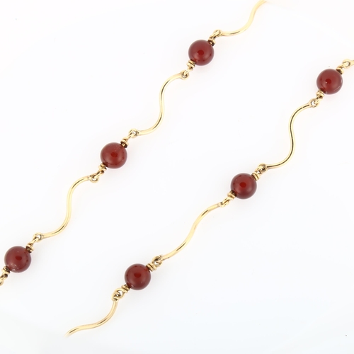 1079 - A 9ct gold carnelian bead necklace, length 42cm, 16.8g