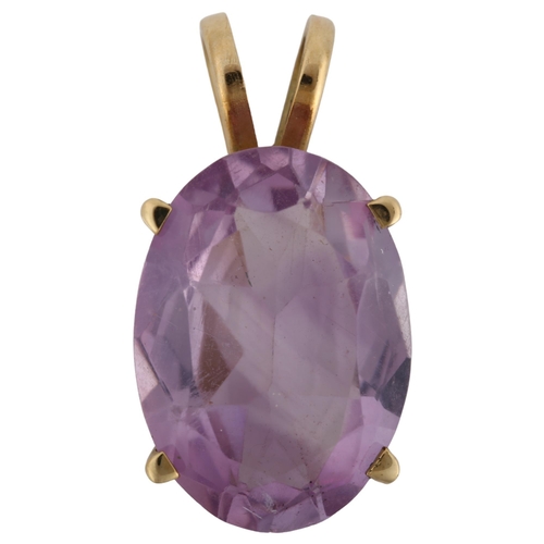 1093 - A 14ct gold amethyst pendant, prong set with oval mixed-cut amethyst, pendant height 23.5mm, 4.2g