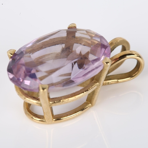 1093 - A 14ct gold amethyst pendant, prong set with oval mixed-cut amethyst, pendant height 23.5mm, 4.2g