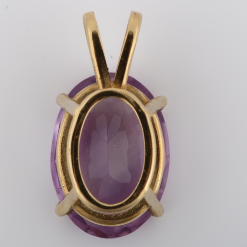 1093 - A 14ct gold amethyst pendant, prong set with oval mixed-cut amethyst, pendant height 23.5mm, 4.2g