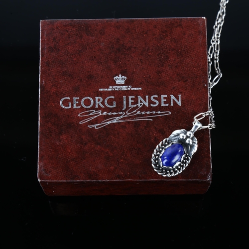 1231 - GEORG JENSEN - a Danish stylised sterling silver and lapis lazuli pendant necklace of the year 1992,... 