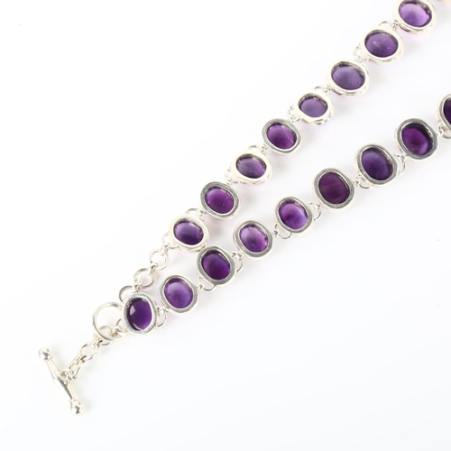 1235 - A large modern silver graduated amethyst fringe necklace, set with oval cabochon amethyst, necklace ... 