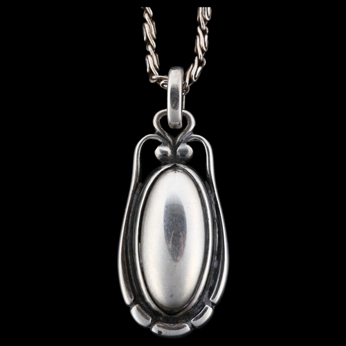 1237 - GEORG JENSEN - a Danish modernist sterling silver pendant necklace of the year 2000, on silver fancy... 