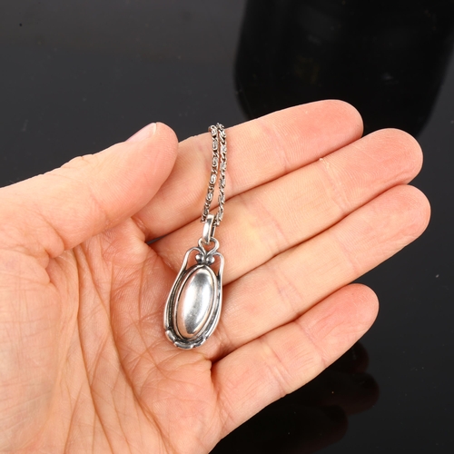 1237 - GEORG JENSEN - a Danish modernist sterling silver pendant necklace of the year 2000, on silver fancy... 