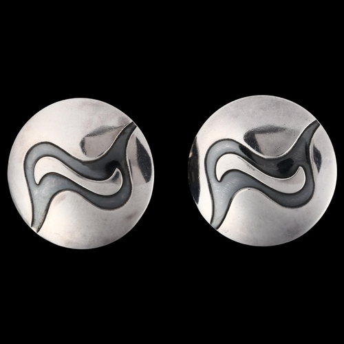 1238 - NIELS ERIK FROM - a pair of Danish sterling silver and niello abstract disc earrings, with clip fitt... 