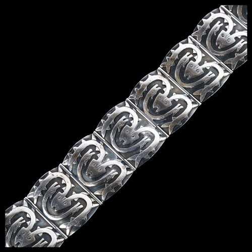 1239 - A Scandinavian sterling silver Viking Revival design panel bracelet, with mythological creatures, br... 