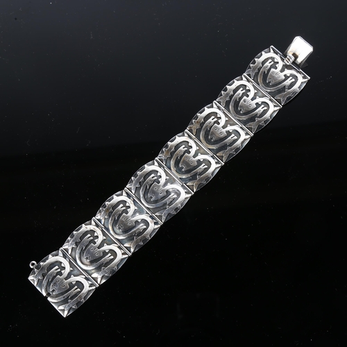 1239 - A Scandinavian sterling silver Viking Revival design panel bracelet, with mythological creatures, br... 