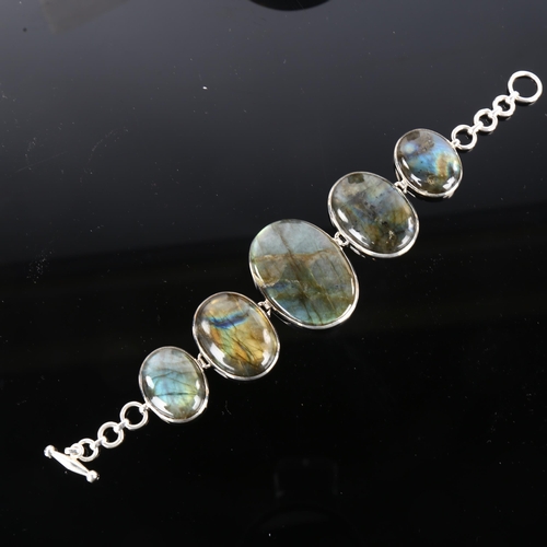 1250 - A large sterling silver labradorite panel bracelet, set with oval cabochon labradorite, largest pane... 