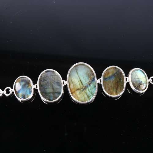 1250 - A large sterling silver labradorite panel bracelet, set with oval cabochon labradorite, largest pane... 