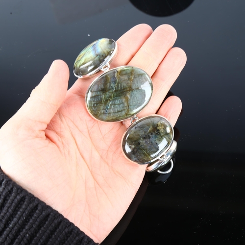 1250 - A large sterling silver labradorite panel bracelet, set with oval cabochon labradorite, largest pane... 