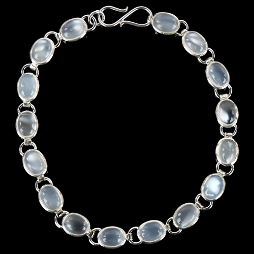 1255 - A silver moonstone line bracelet, set with oval cabochon moonstone, bracelet length 18.5cm, 9.3g