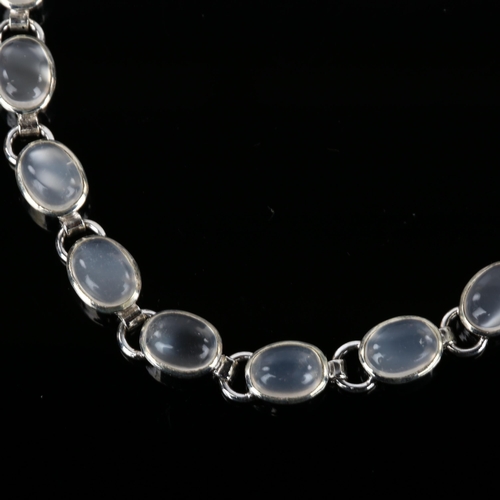 1255 - A silver moonstone line bracelet, set with oval cabochon moonstone, bracelet length 18.5cm, 9.3g