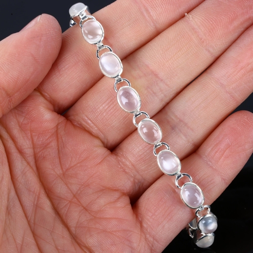 1255 - A silver moonstone line bracelet, set with oval cabochon moonstone, bracelet length 18.5cm, 9.3g