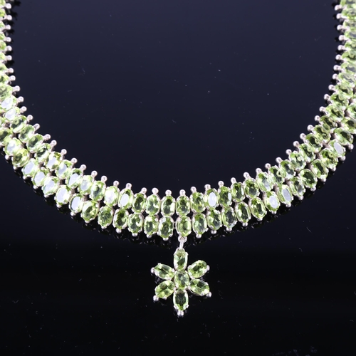 1257 - A handmade sterling silver peridot collar pendant necklace, set with oval mixed-cut peridot with flo... 