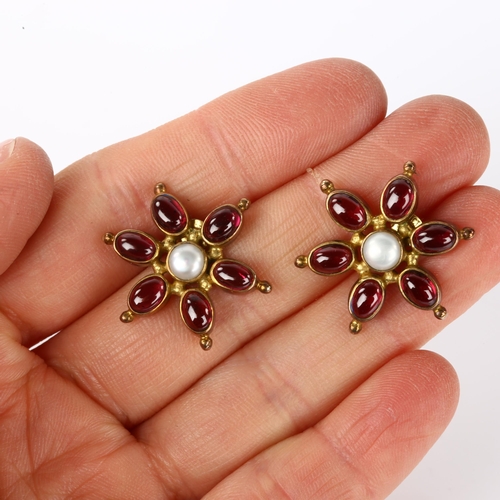 1261 - A pair of silver-gilt garnet and pearl ship's wheel earrings, earring diameter 23.8mm, 7.3g