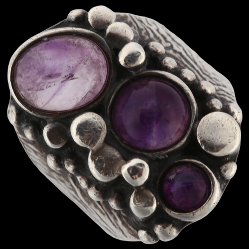 1264 - A Norwegian brutalist sterling silver and amethyst ring, set with oval and round cabochon amethyst, ... 