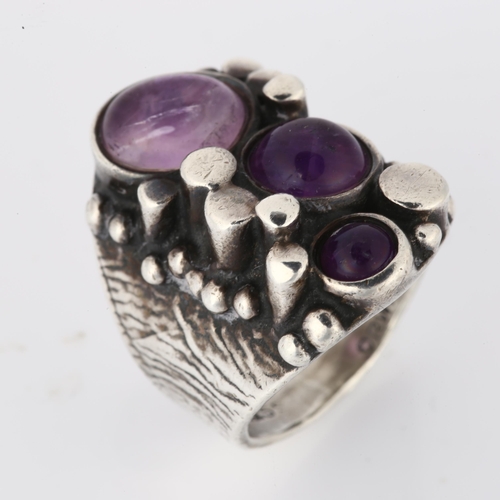 1264 - A Norwegian brutalist sterling silver and amethyst ring, set with oval and round cabochon amethyst, ... 