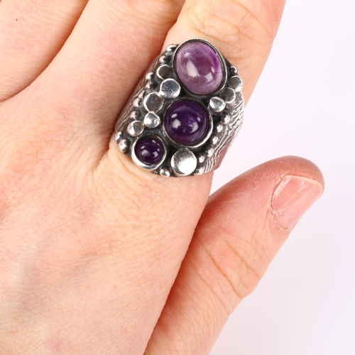 1264 - A Norwegian brutalist sterling silver and amethyst ring, set with oval and round cabochon amethyst, ... 