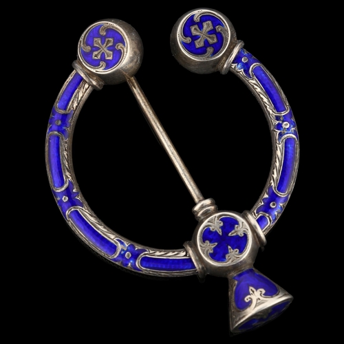 1275 - A 19th century Scottish Celtic blue enamel penannular brooch, unmarked silver settings with allover ... 