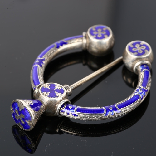 1275 - A 19th century Scottish Celtic blue enamel penannular brooch, unmarked silver settings with allover ... 