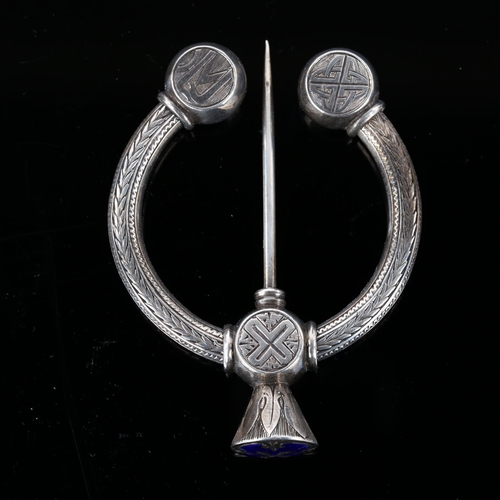 1275 - A 19th century Scottish Celtic blue enamel penannular brooch, unmarked silver settings with allover ... 