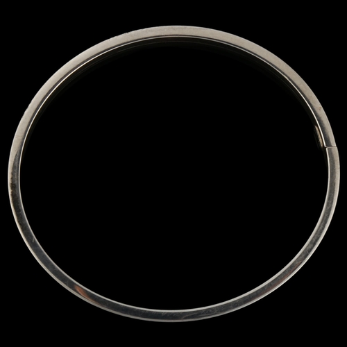 1284 - PER E LANGE - a Danish sterling silver plain form torque bangle, band width 6mm, internal circumfere... 