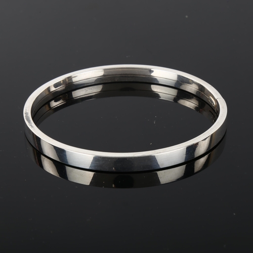 1284 - PER E LANGE - a Danish sterling silver plain form torque bangle, band width 6mm, internal circumfere... 