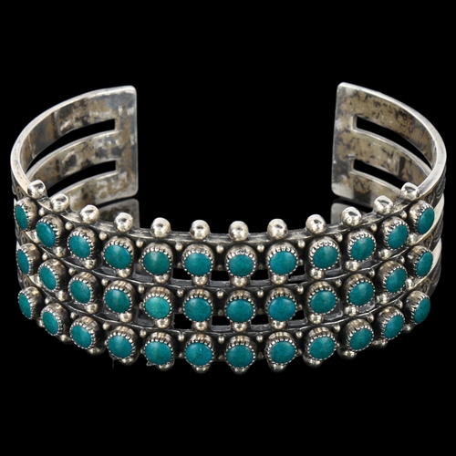 1286 - A Native American Navajo sterling silver and turquoise cuff bracelet, band width 23.5mm, internal ci... 