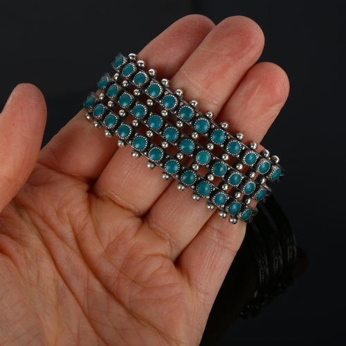 1286 - A Native American Navajo sterling silver and turquoise cuff bracelet, band width 23.5mm, internal ci... 