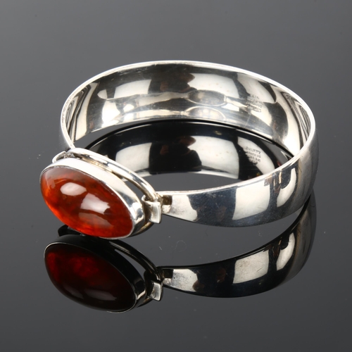 1290 - NIELS ERIK FROM - a Danish modernist sterling silver and amber bracelet, setting height 18.4mm, inte... 