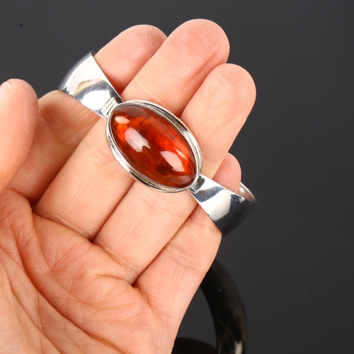 1290 - NIELS ERIK FROM - a Danish modernist sterling silver and amber bracelet, setting height 18.4mm, inte... 