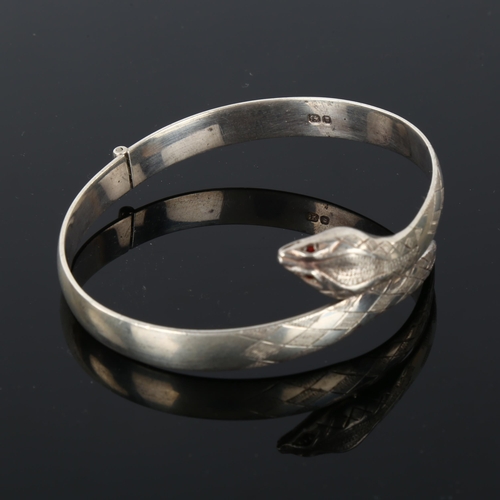 1296 - A late 20th century silver figural snake hinged bangle, hallmarks London 1975, band width 7.6mm, int... 