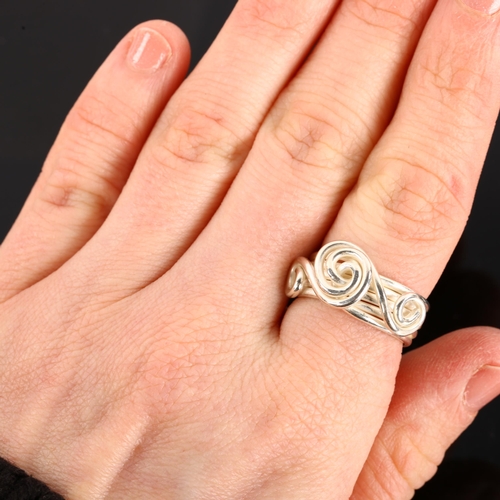 1312 - A handmade sterling silver abstract band ring, with spiral motif, by Claude Wilkes, setting height 1... 