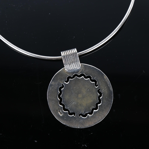 1341 - An Egyptian silver pendant neck torque, pendant height 62.1mm, internal circumference approx 40cm, 4... 