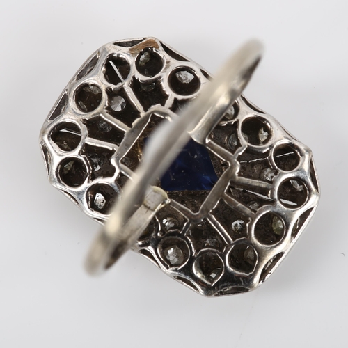 1348 - An Art Deco sapphire and diamond panel ring, unmarked white metal settings with lozenge step cut sap... 