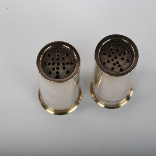 1354 - A pair of late Victorian novelty silver shotgun cartridge pepper pots, with screw-off bases and pier... 