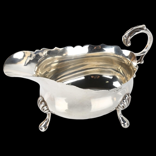 1388 - A George VI silver sauce boat, with C-shaped scrolled acanthus leaf handle, by Edward Barnard & Sons... 