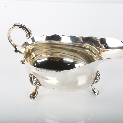 1388 - A George VI silver sauce boat, with C-shaped scrolled acanthus leaf handle, by Edward Barnard & Sons... 