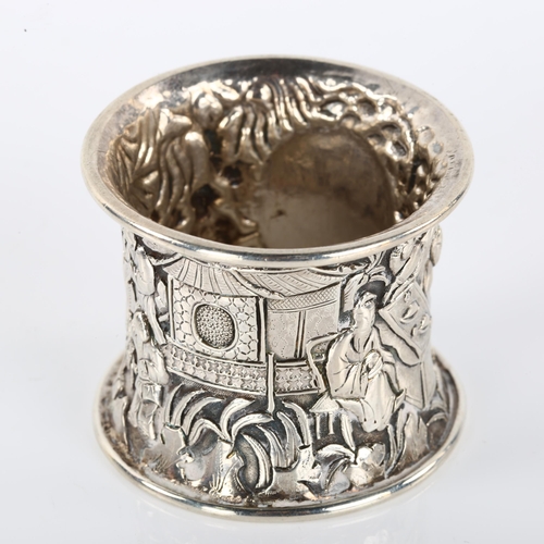 1398 - A heavy Chinese export silver napkin ring, relief embossed village scene decoration, circa 1900, dia... 