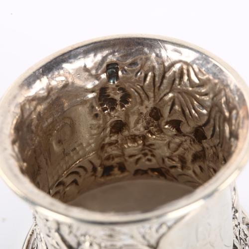 1398 - A heavy Chinese export silver napkin ring, relief embossed village scene decoration, circa 1900, dia... 