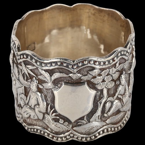 1399 - A Chinese export cast-silver napkin ring, relief village scene decoration, by Wang Hing, circa 1900,... 